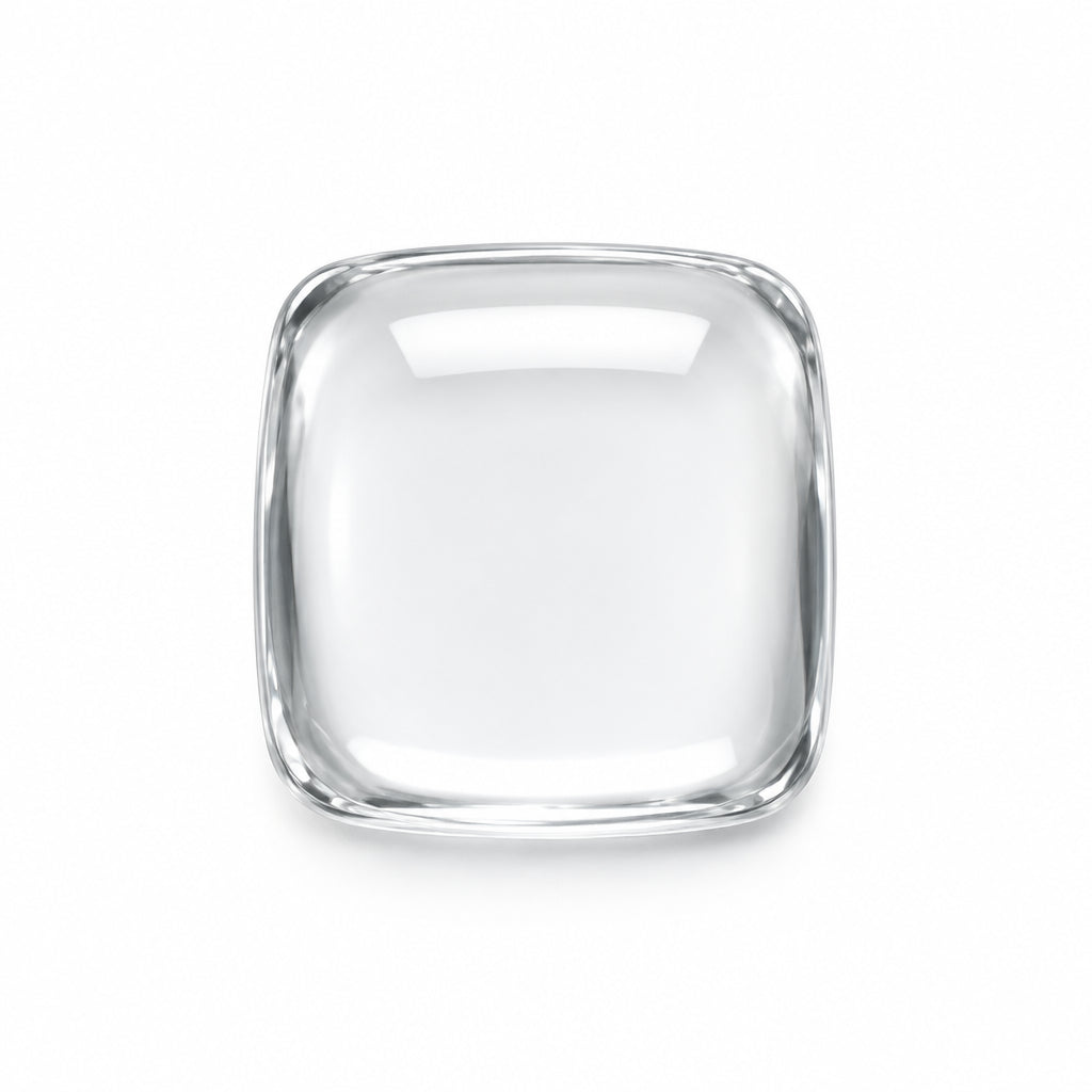 A single clear, transparent square cabochon gemstone with rounded corners, displayed on a neutral light gray background.