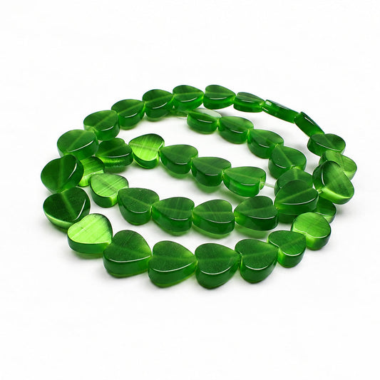 A strand of translucent green heart-shaped beads arranged in loops on a plain white background.