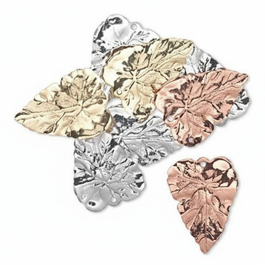 Five metallic leaf-shaped jewelry findings in gold, silver, and rose gold tones, arranged on a plain white background.