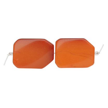 Two orange translucent rectangular beads with rounded corners and silver wire ends, shown on a plain white background.
