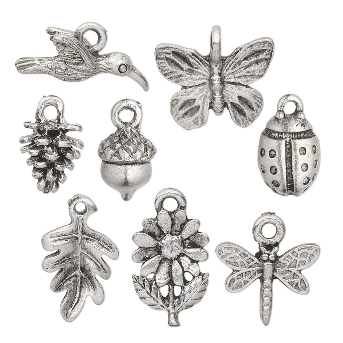 A set of nine silver-toned metal charms with antique finish, featuring nature-inspired designs like a bird, butterfly, pine cone, acorn, ladybug, oak leaf, flower, and dragonfly, arranged on a plain white background.