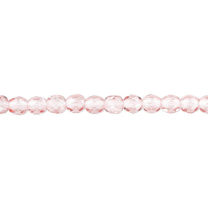 A single strand of faceted light pink glass beads aligned horizontally on a plain white background.