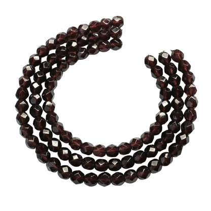 A multi-strand beaded necklace featuring faceted dark red garnet beads and a silver-tone lobster clasp, displayed on a clean white background.