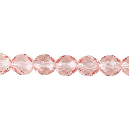 Faceted round beads in a light pink color, shown in a horizontal line on a plain white background.