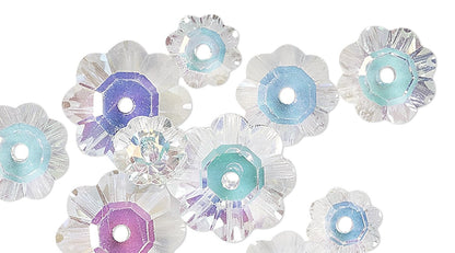 Decorative flower-shaped beads with pastel colors on a white background