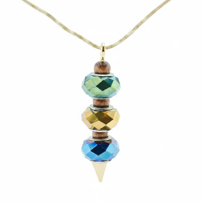 A beaded pendant necklace with faceted beads in green, gold, and blue, suspended from a thin gold cord. The pendant features small brown wooden beads and a gold cone tip.
