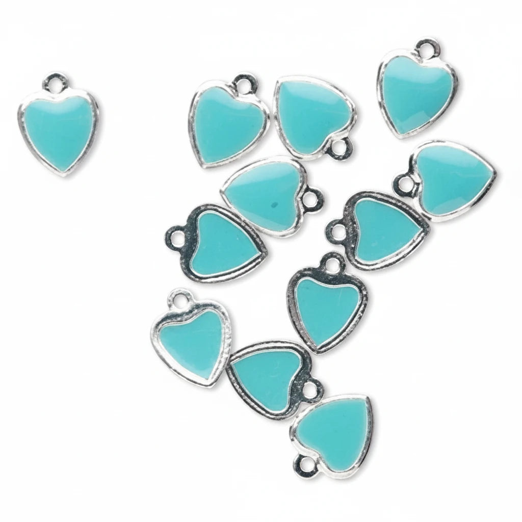 A set of heart-shaped jewelry charms with light turquoise blue enamel and silver-tone metal borders, arranged on a plain white background.