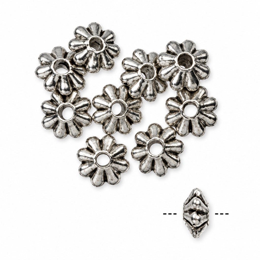 A group of small silver-toned metal flower-shaped beads with a central hole, shown on a plain white background. A single bead is also shown separately to the lower right with dotted measurement guides.