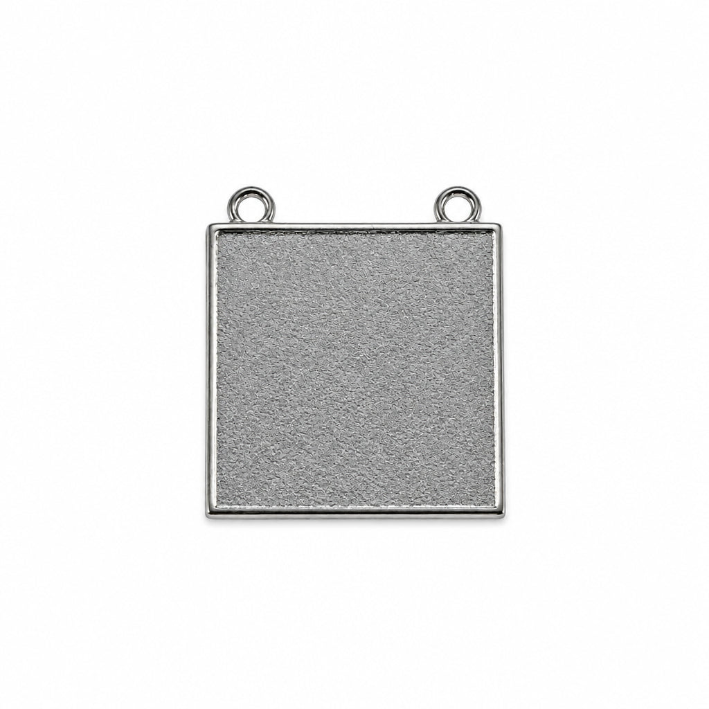 A square silver-toned metal pendant or charm with two small hanging loops at the top corners, shown on a plain white background.