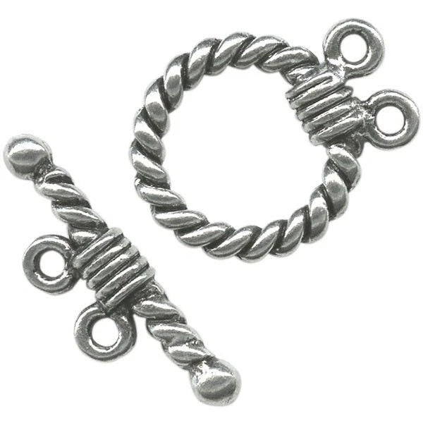 A pair of silver-toned twisted rope toggle clasp jewelry findings on a plain white background.