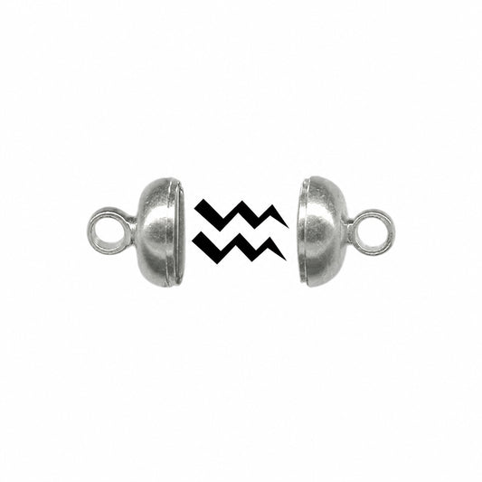 Two silver metal dome-shaped split beads with loop ends, shown apart on a white background with a black zigzag graphic between them.