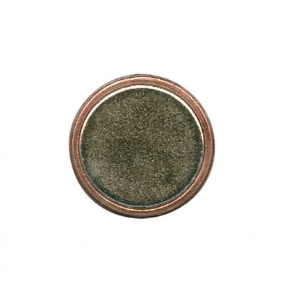 A round COPPER MAGNET set against a light gray background.