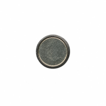 A single round, flat button with a textured dark gray center and a metallic silver outer rim, isolated on a white background.