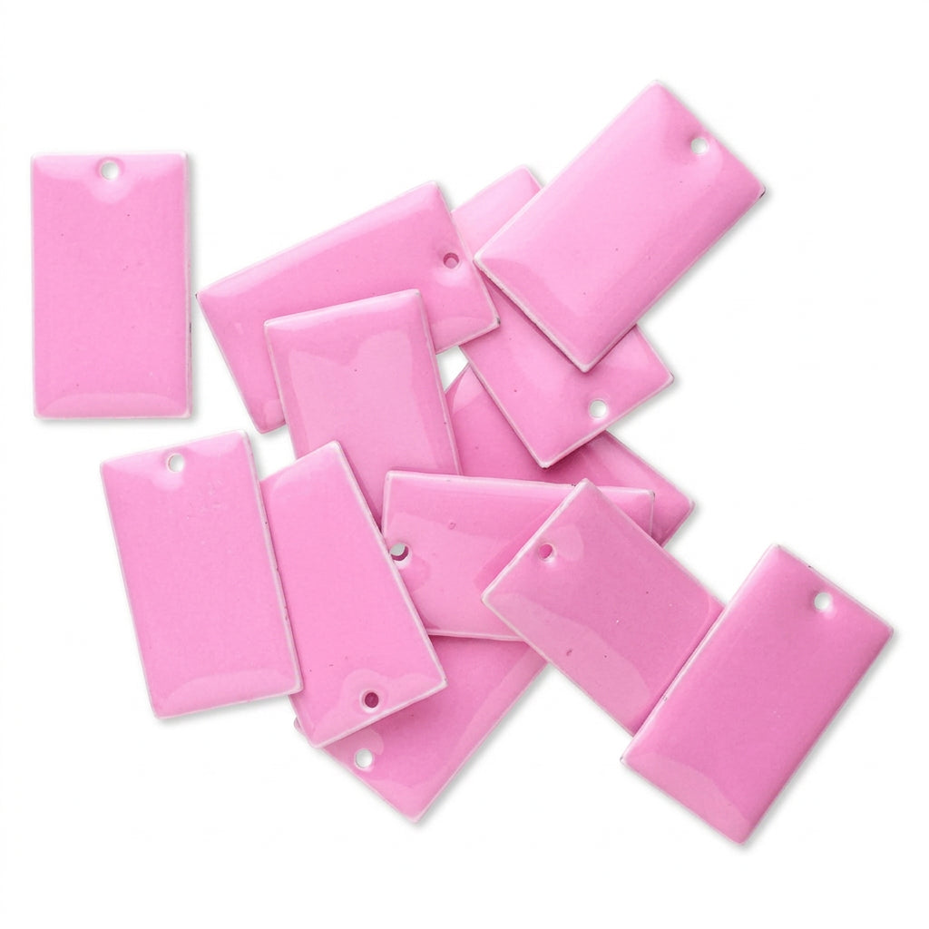 A pile of glossy pink rectangular arranged on a plain white background.