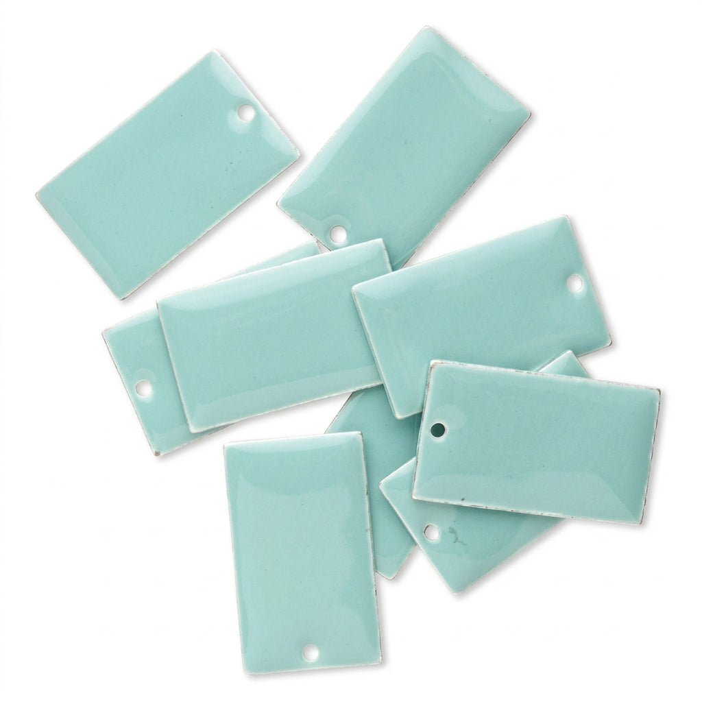 A set of glossy, rectangular ceramic tiles in a light mint green or aqua color, arranged on a plain white background. Each tile features a pre-drilled hole near one corner.