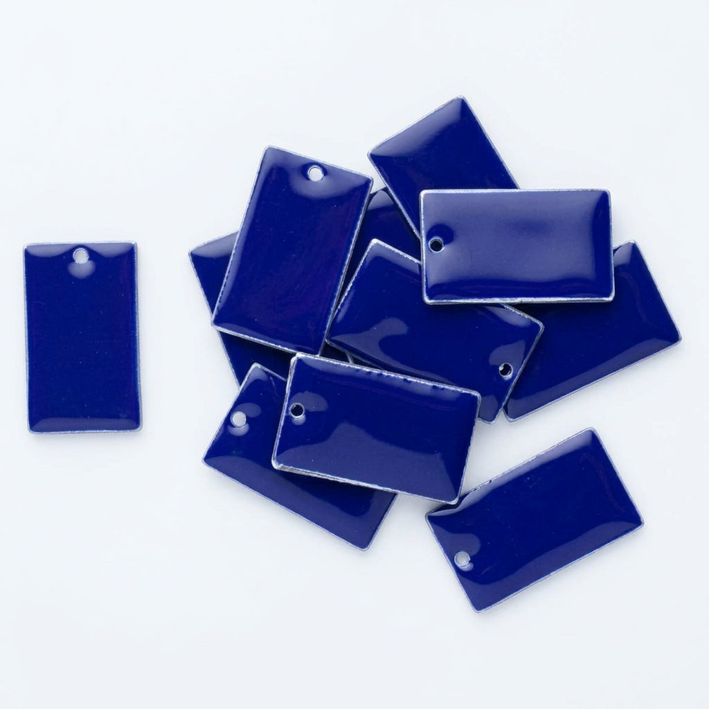 A pile of glossy rectangular blue tags with small hanging holes, shown on a plain white background.