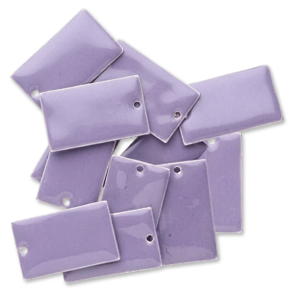 A pile of lavender purple rectangular adhesive pockets with metal grommets, arranged on a plain white background.