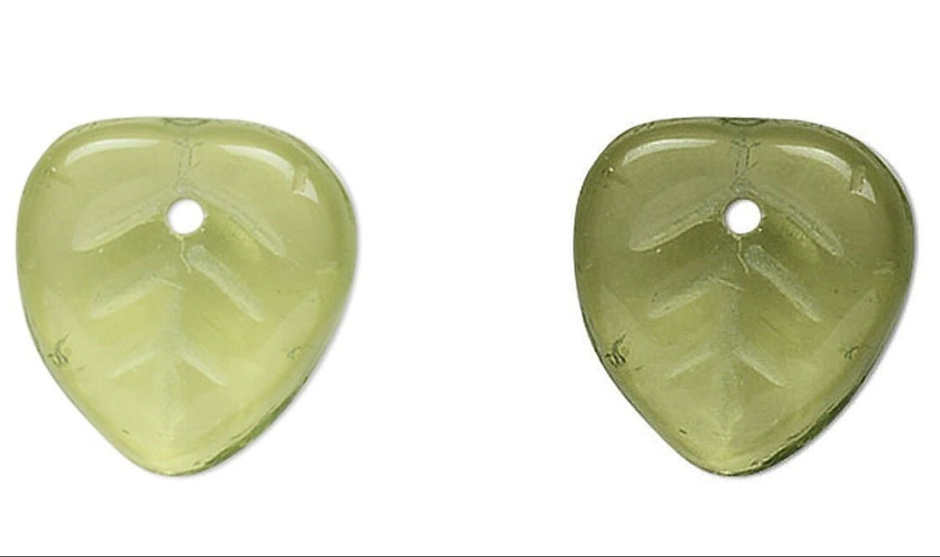 Pair of green leaf-shaped  beads on a white background