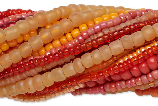 Stack of multicolored beads on a white background