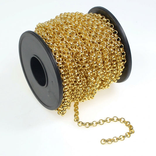 A spool of gold chain with a black plastic core, shown on a plain white background with a few links of the chain unspooled in front.