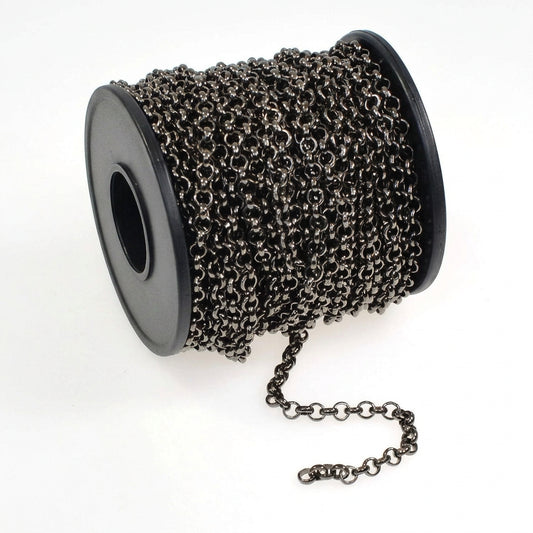 A spool of dark metallic chain links, likely gunmetal gray or black, with an extension chain draped on a white background.