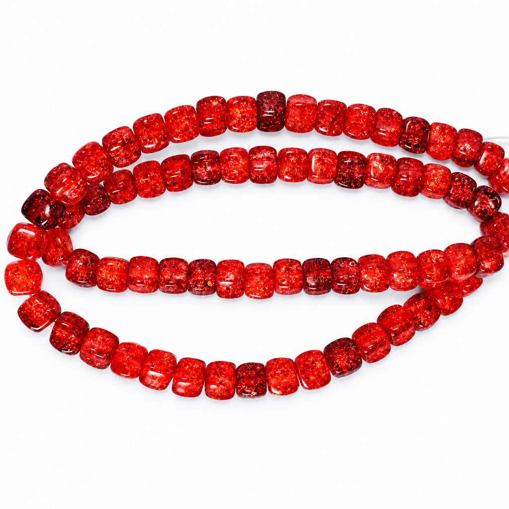 Red clear glass beads with a crushed texture, arranged in two loops on a light blue background.