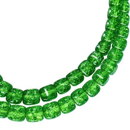 Green clear crystal bead strands on a white background.