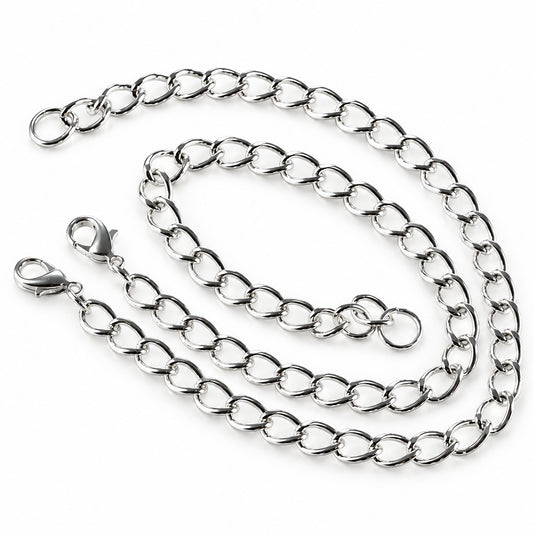 A silver-tone metal chain necklace with elongated oval links and a lobster clasp, photographed on a plain light background.
