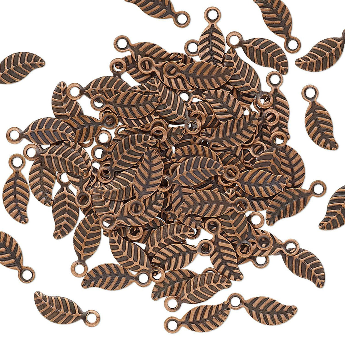 A pile of small leaf-shaped metal charms with loop tops, shown on a plain white background.