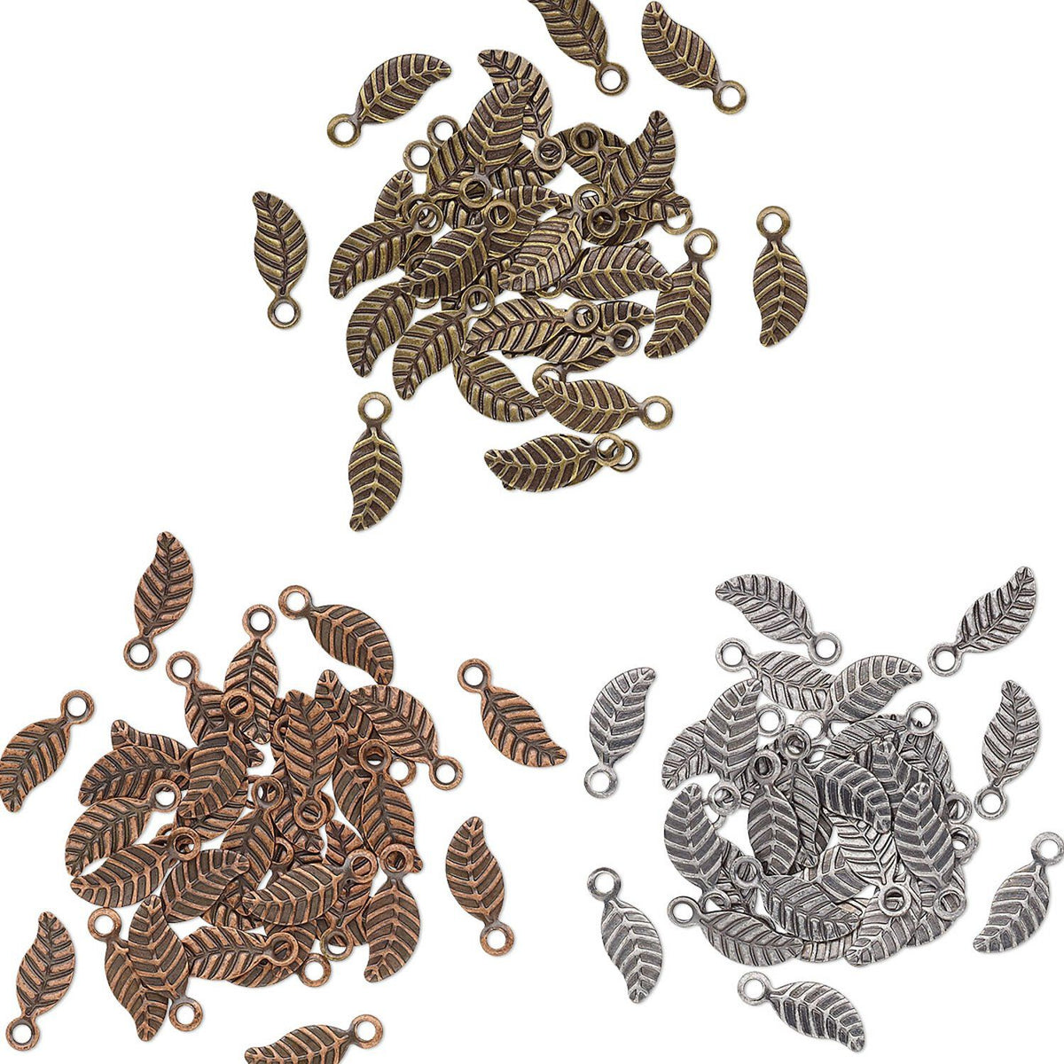 Three piles of small leaf-shaped metal charms or pendants with loop tops, shown on a plain white background. The top pile is antique bronze/copper-toned, the bottom left is reddish bronze/copper-toned, and the bottom right is silver-toned.