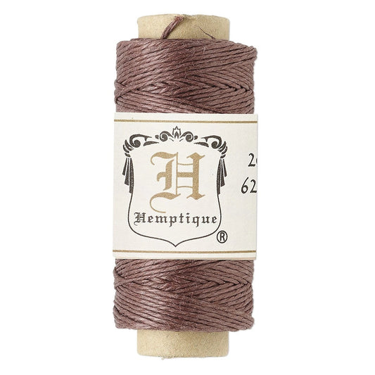 A spool of Hemptique thread in a dusty mauve-brown shade, wound on a light tan cardboard core with a cream-colored paper label.