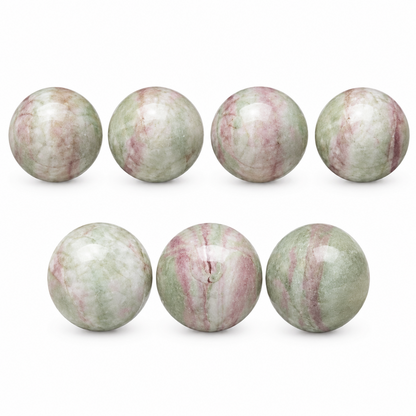 Six polished round stone beads with a marbled pattern of pale green, white, and pinkish tones, arranged in two rows of three on a plain white background.