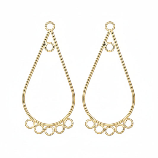 A pair of gold-plated teardrop-shaped wire hoop earrings with small circular cutouts along the bottom, shown on a plain white background.