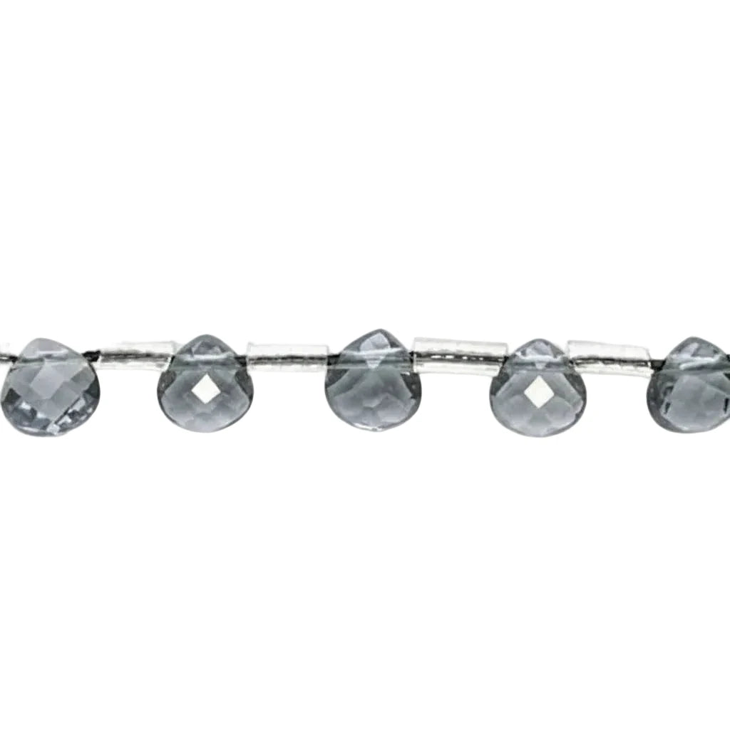 Faceted gray glass beads strung on a silver wire, shown against a plain white background.