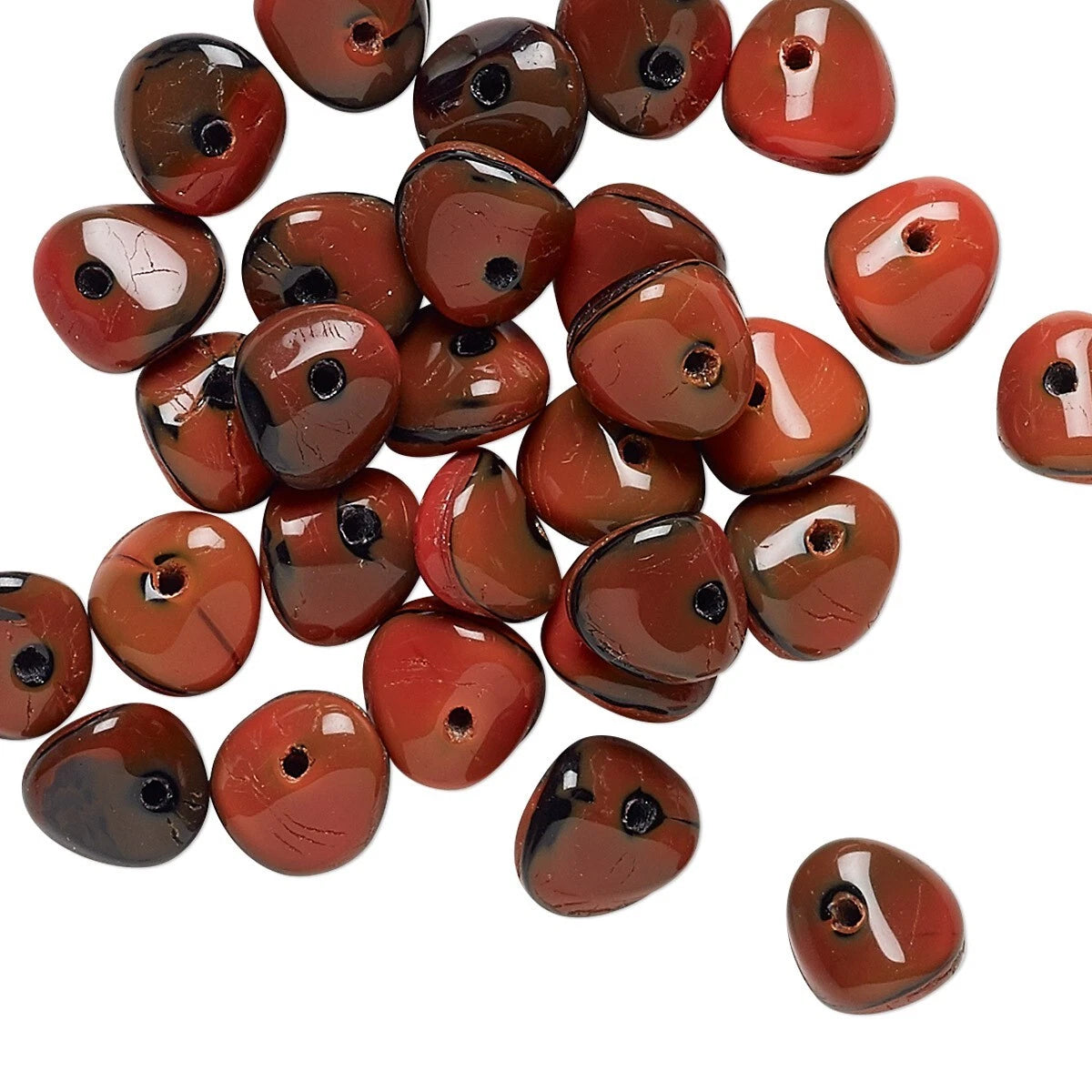 A pile of glossy, teardrop-shaped red jasper beads with pre-drilled holes, displayed on a clean white background.