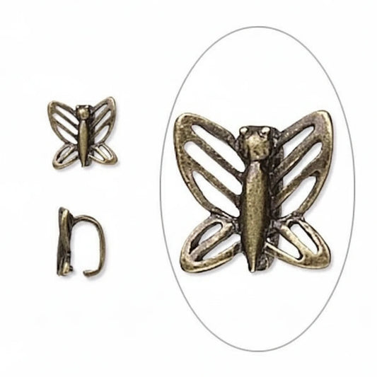 An antique bronze butterfly-shaped bead or charm shown on a white background, with a smaller inset view of the back clasp and a larger oval close-up of the front.