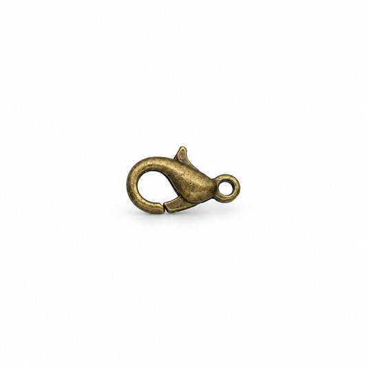 A single small lobster clasp jewelry finding with an antique brass finish, centered on a solid white background.