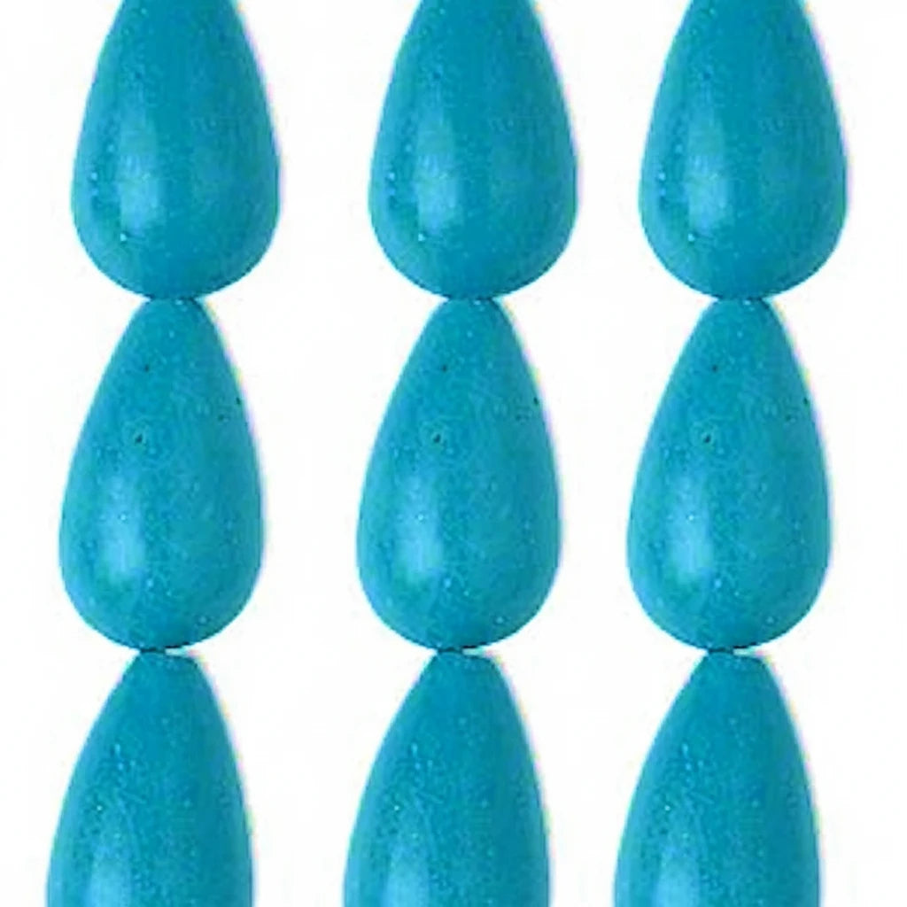 Six turquoise blue teardrop-shaped beads arranged in a grid on a plain white background.