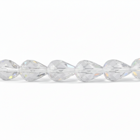 A close-up of a faceted clear bead strand, showing multiple transparent teardrop-shaped beads with prismatic cuts reflecting light on a white background.