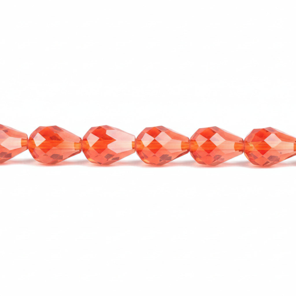 Faceted round beads in a vibrant orange-red color, shown in a horizontal line on a plain white background.
