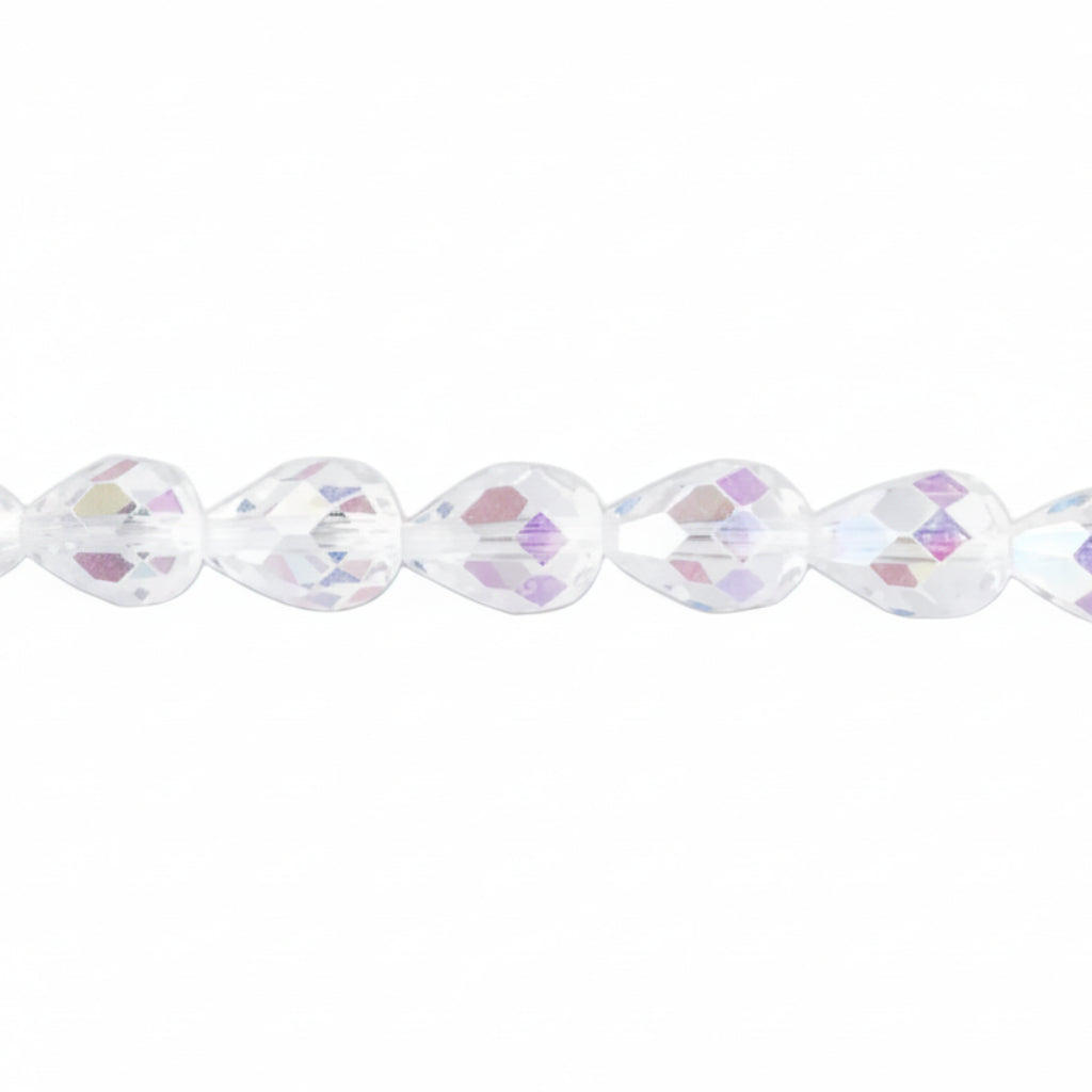A close-up of faceted teardrop-shaped beads on a strand, showing a clear iridescent finish with subtle pink, purple, and blue reflections against a white background.