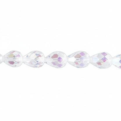 A close-up of faceted teardrop-shaped beads on a strand, showing a clear iridescent finish with subtle pink, purple, and blue reflections against a white background.