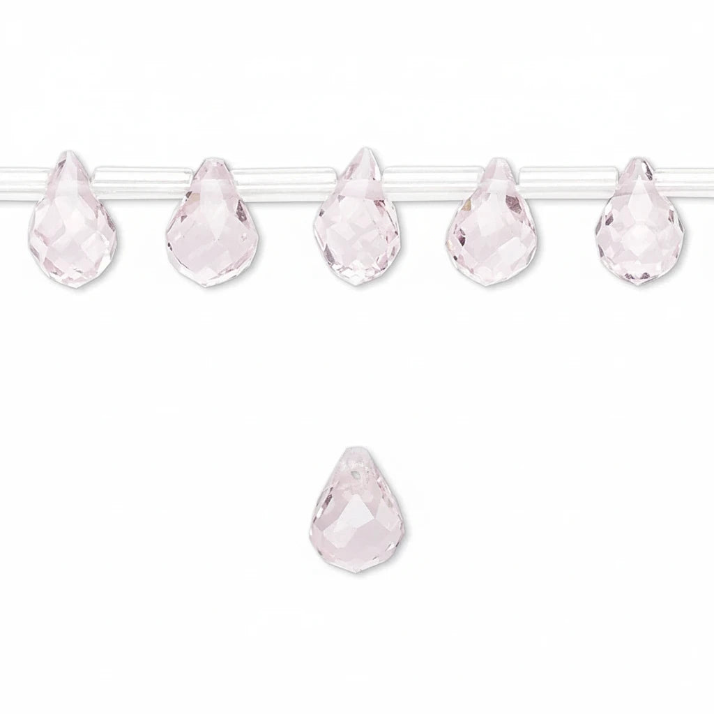 Five faceted light pink teardrop-shaped beads strung on a clear cord, with one matching bead shown below on a plain white background.