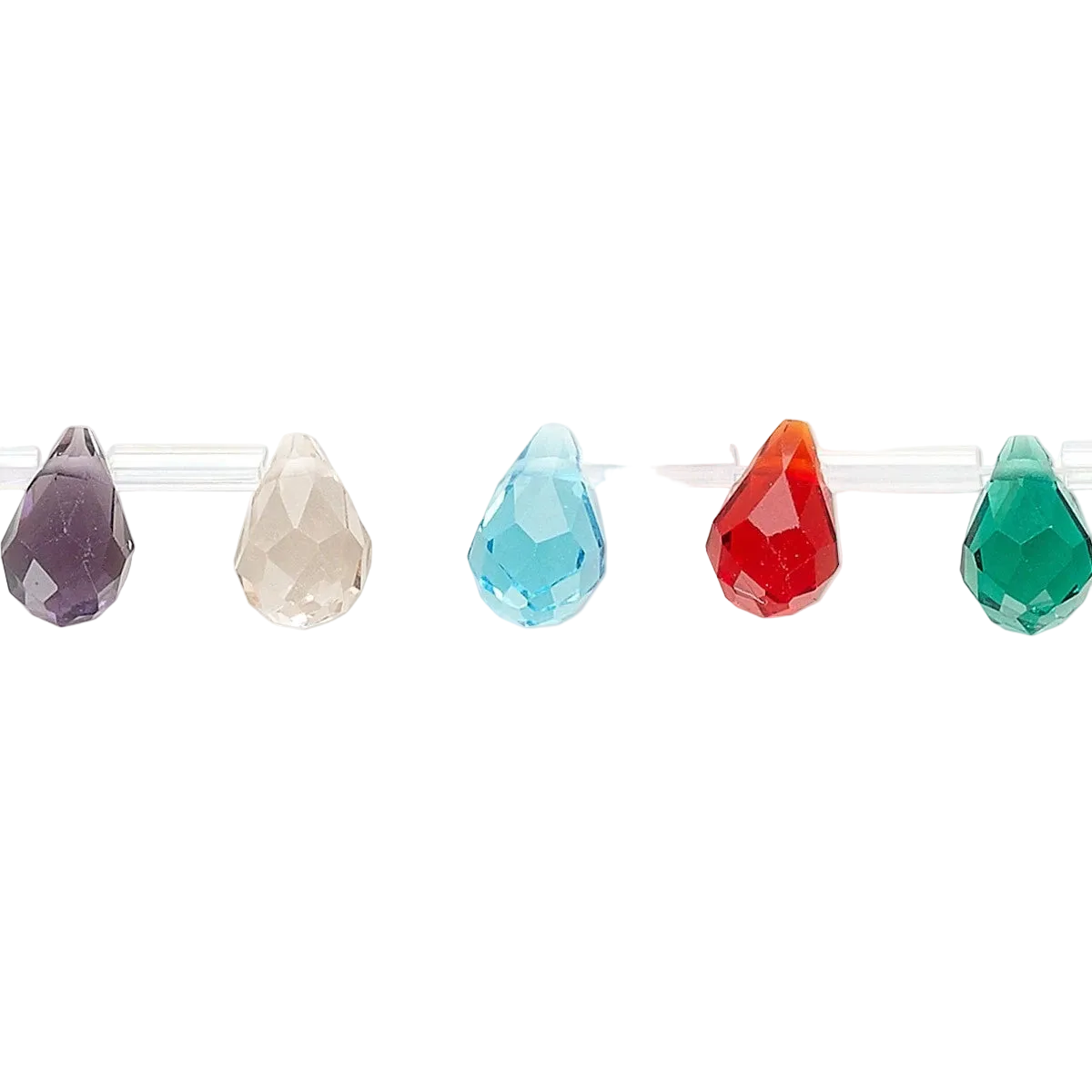 Five faceted teardrop-shaped beads in different colors, including purple, cream, light blue, red-orange, and green, displayed on a clear stand against a white background.