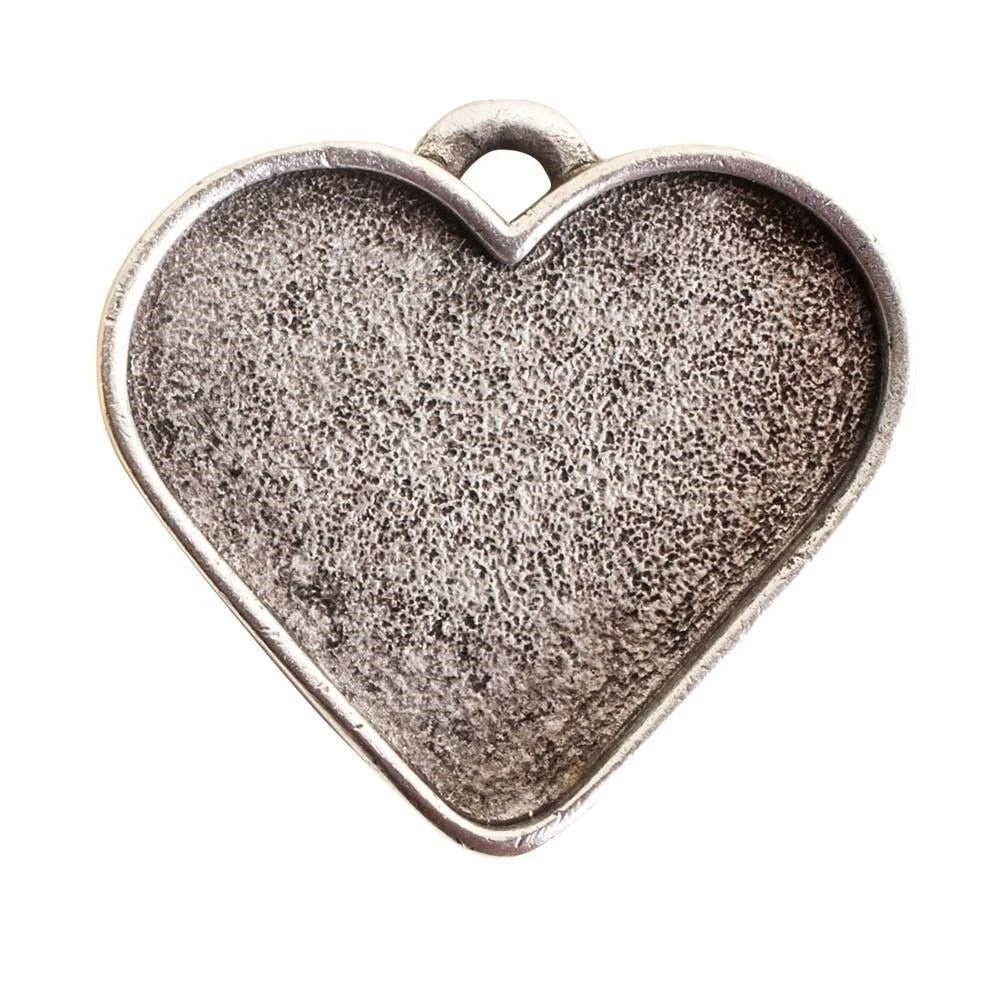 A heart-shaped silver metal charm with a textured, oxidized finish and a small loop at the top, shown on a plain white background.