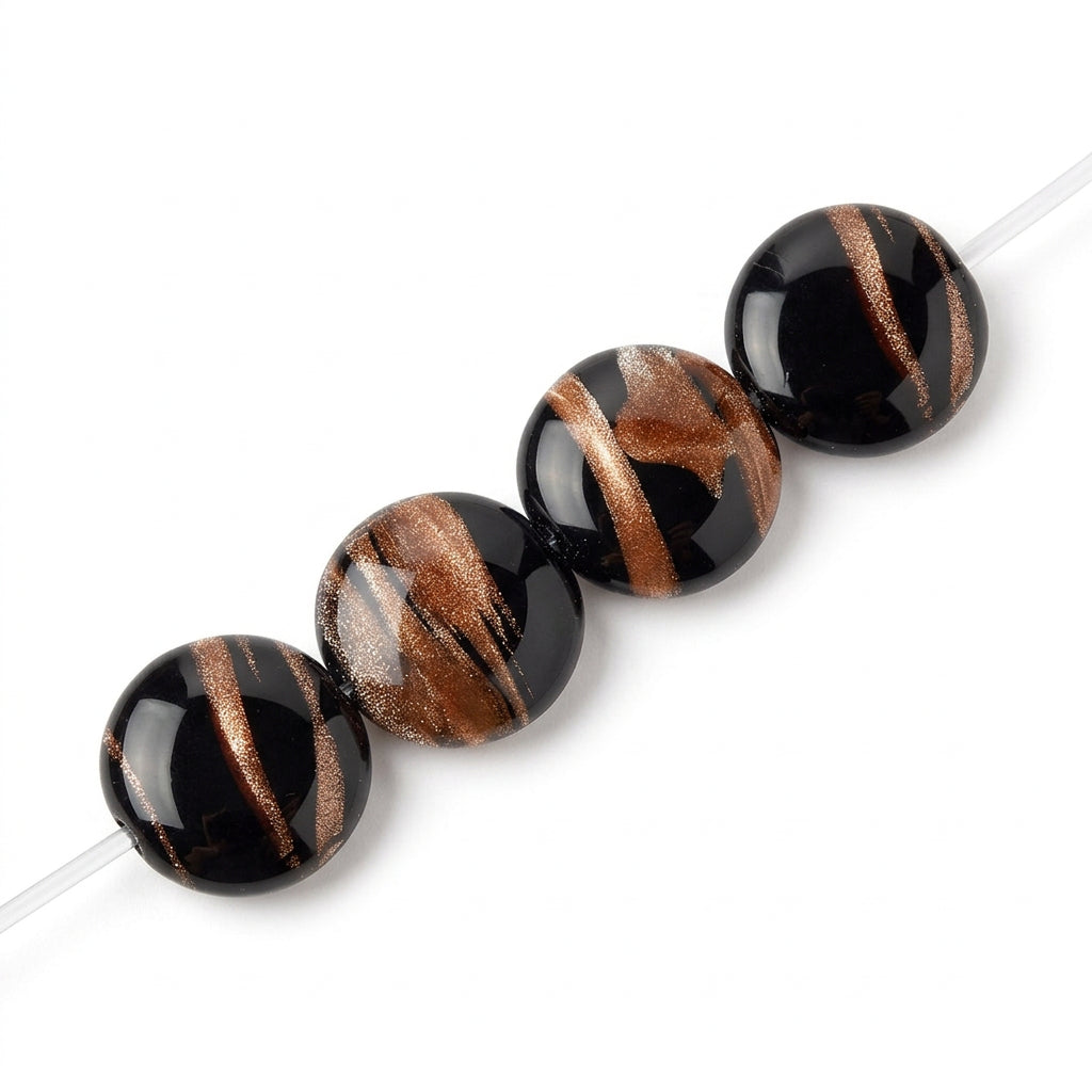 Close-up of round black beads with metallic gold and bronze streaks, shown against a plain white background.