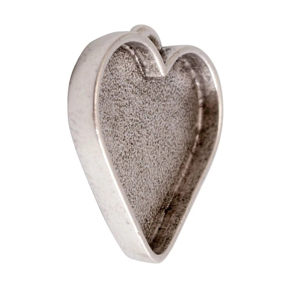 A heart-shaped metallic pendant or charm with a textured, oxidized silver finish, shown on a plain white background.