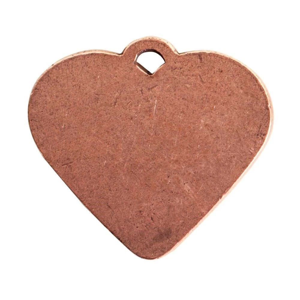 A blank, unfinished heart-shaped metal tag or pendant in a warm copper/bronze finish, featuring a small loop at the top, shown on a solid white background.