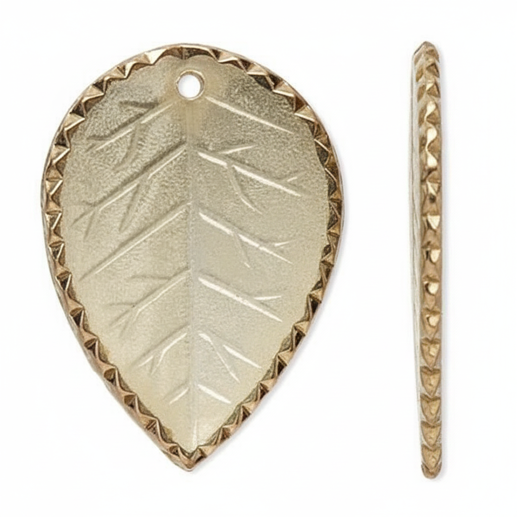 A gold-toned metal leaf-shaped charm with a textured embossed leaf pattern and a beaded border, shown from the front and side on a white background.
