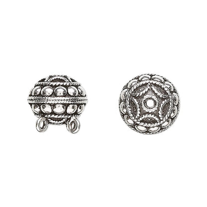 Two silver-toned ornate beads shown on a plain white background, one displaying the front with hanging loops and the other showing the detailed top view.